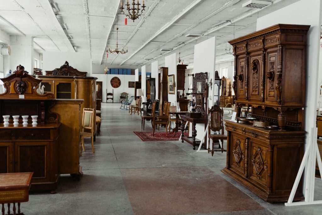Antique wooden furniture showroom with vintage cabinets and classic interior pieces