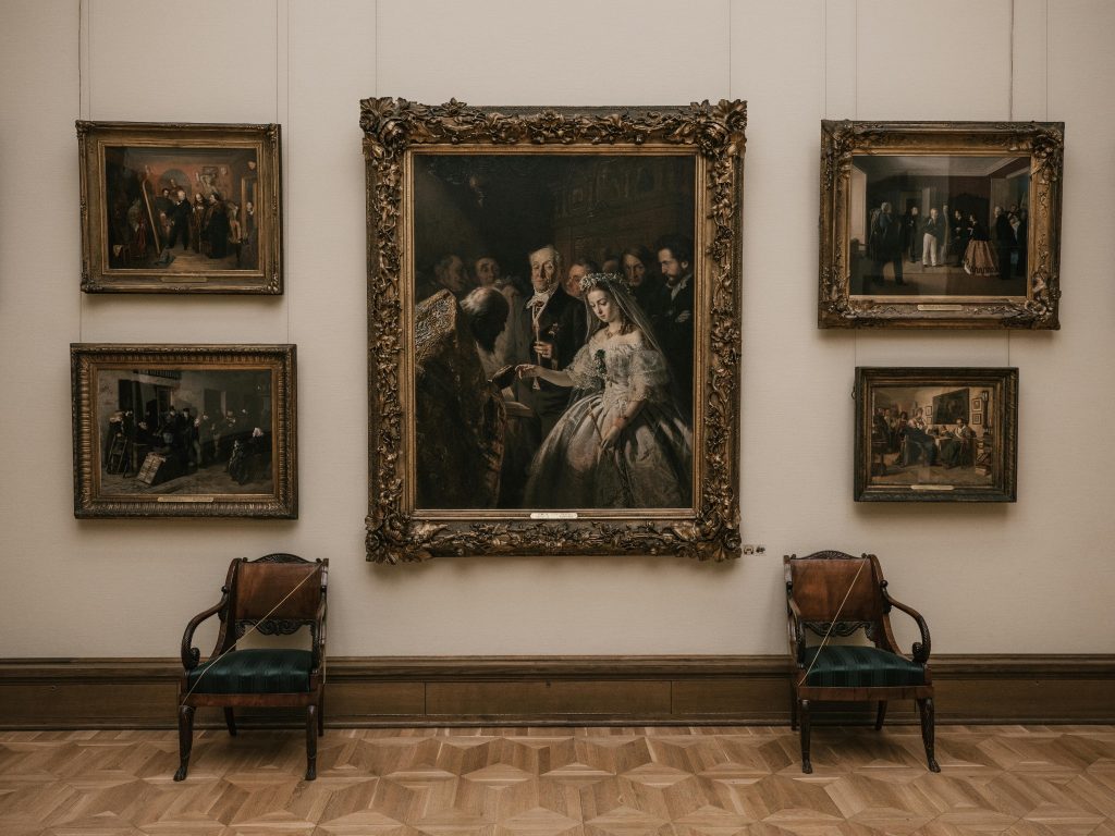 Vintage framed paintings displayed in elegant art gallery interior